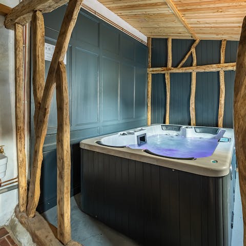 Unwind with a glass of wine in the shared hot tub