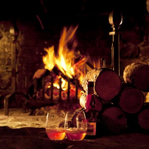 Cosy up in front of the fire with a French aperitif in hand