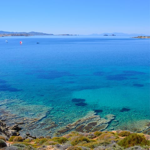 Spend your days swimming in the clear shallows of Agia Irini – it's only 650m away