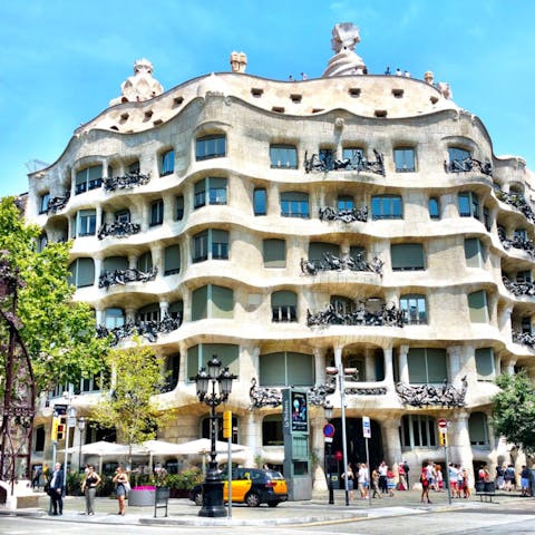 Admire the iconic Casa Milà, a short walk away
