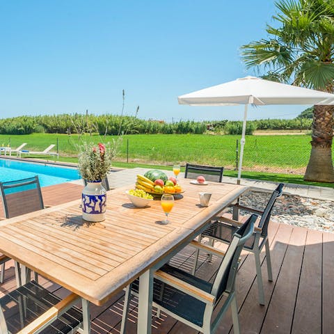 Eat and drink local produce in the villa's spacious outdoor dining area