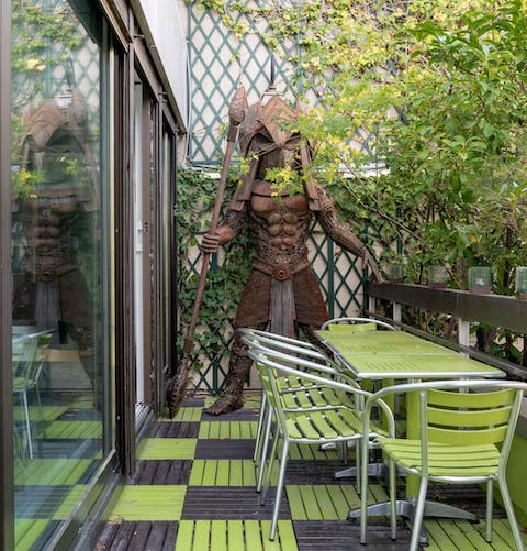Take your morning coffee in the alfresco dining area accompanied by a full-size warrior for extra security