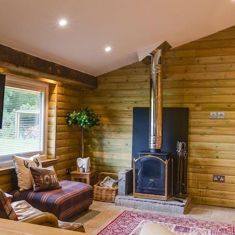 Cuddle up on the sofa next to the log burner fireplace on cold winter evenings