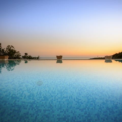 Slip into the heated swimming pool with massage jets as the sun starts to set 