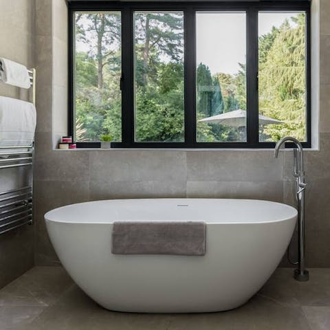 Take a relaxing soak in the freestanding tub