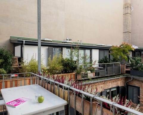Get some fresh air on the balcony with views over the courtyard