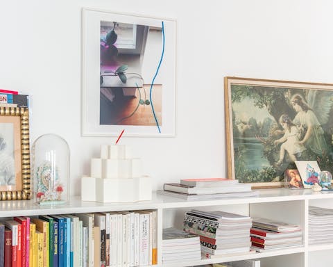 Admire the  home's art, trinkets and books