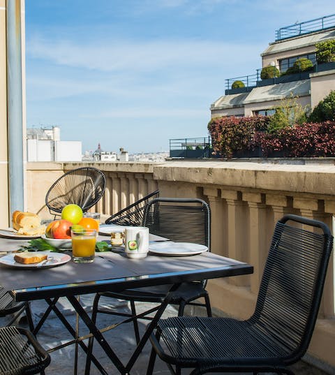 Savour breakfast on the balcony while taking in the views over the rooftops of Paris