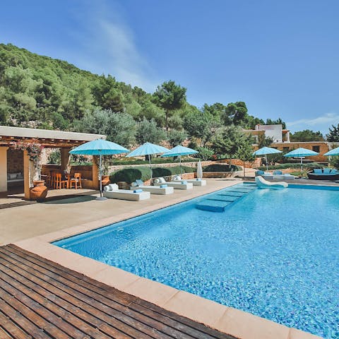 Spend idyllic days lounging by the pool and gazing at the views