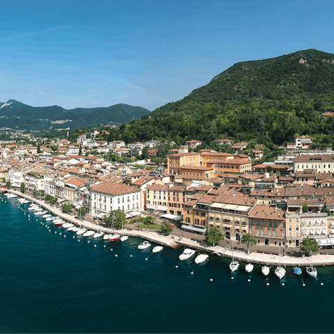 Drive six minutes to Salò, a charming town with a promenade running along Lake Garda