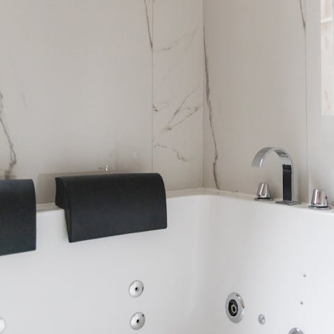 Luxuriate in the whirlpool bathtub with a glass of Italian wine