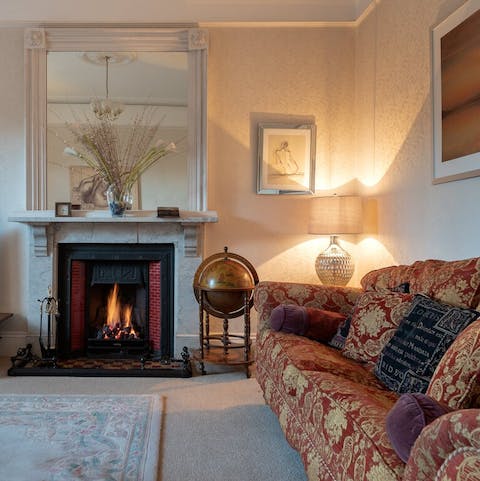 Cosy up around the fire after a coastal walk with the dog