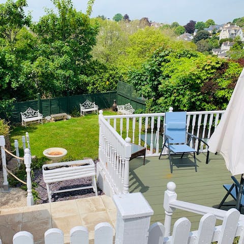 Relax in your private tiered garden, with views over the neighbourhood from the elevated terrace 
