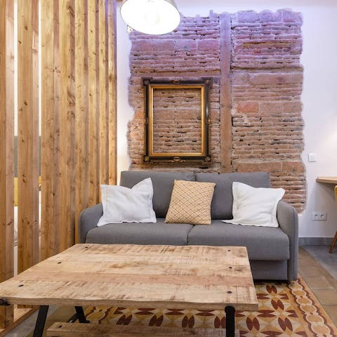 Curl up on the sofa in the rustic living space with a cup of coffee