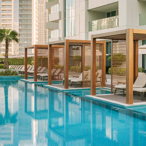 Relax by the shared pool before a session in the on-site spa