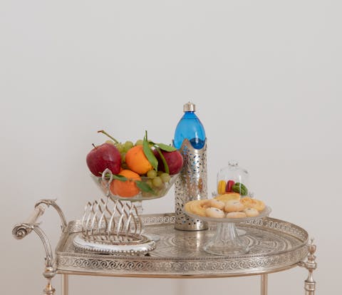 Serve fruit and pastries on the ornate breakfast cart