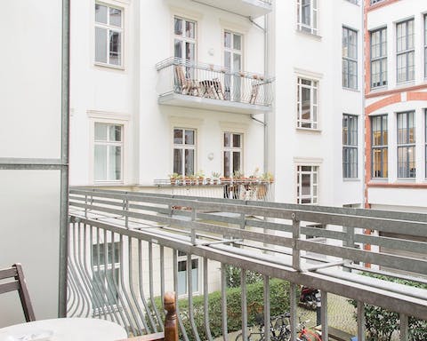 Sip your morning coffee on the private balcony overlooking a peaceful courtyard 
