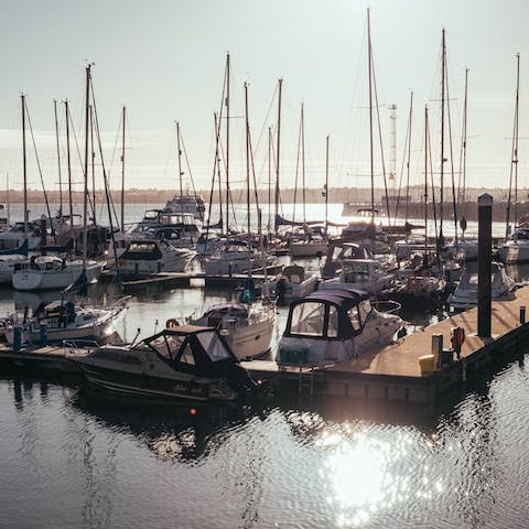 Watch the yachts sail in and out of Ocean Village Marina, a nine-minute walk away