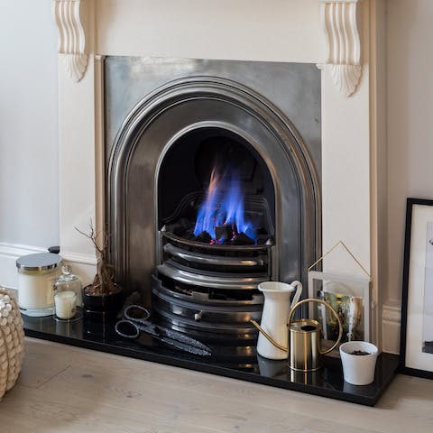 Get cosy by the fireplace