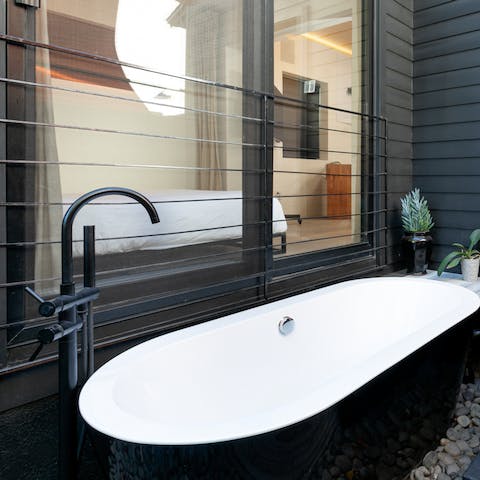 Enjoy an alfresco soak in the outdoor bathtub