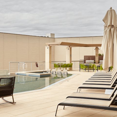 Cool off after a day in the Texan heat with a dip in the building's rooftop pool