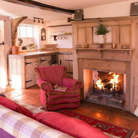 Warm your toes by the crackling wood-burning fire