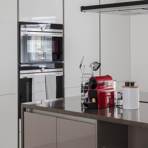 Rustle up a delicious meal in the sleek, high-end kitchen