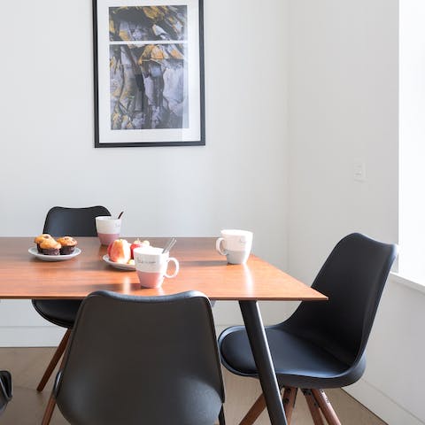 Sit down in the sleek Eames-inspired dining chairs for breakfast