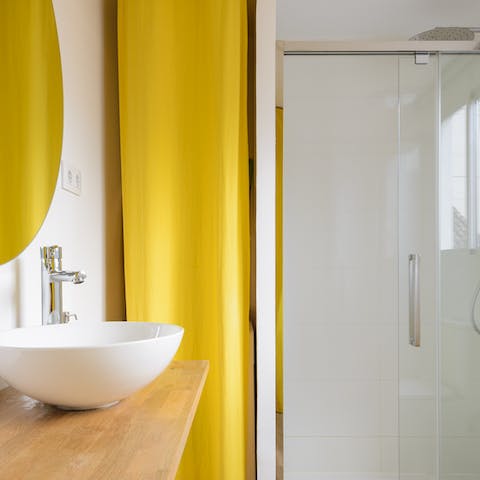 Feel anew in the chic bathrooms, both with rainfall showers