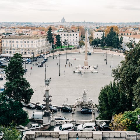 Stroll 500m to Piazza del Popolo to sip coffee and watch the world go by