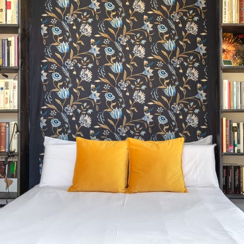 Admire quirky features like the decorative, floral headboard