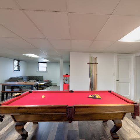 Play a game of pool after a stroll around this home's meadows