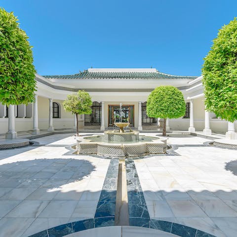 Explore the palatial grounds of the villa's three wings