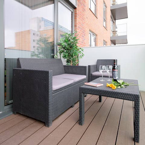 Take a bottle of wine out to your private balcony for the evening