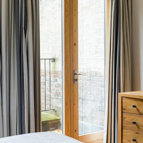 Step through a balcony adjoining the bedrooms