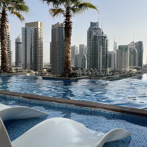 Take in the iconic Dubai cityscape while soaking up the sun poolside