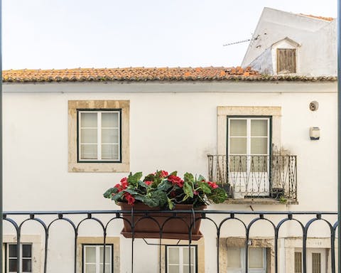 Enjoy your morning coffee perching by the Juliet balcony, taking in views of your quiet street and the city's rooftops beyond