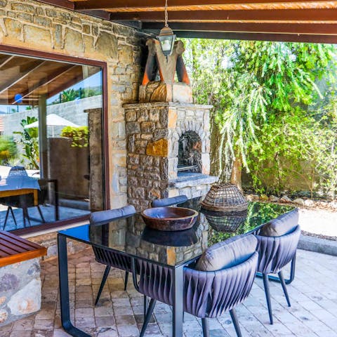 Gather around the dining table on the covered terrace for barbecue dinners