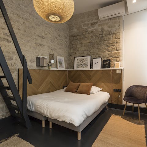 Admire the exposed stone walls and modern collection of furniture