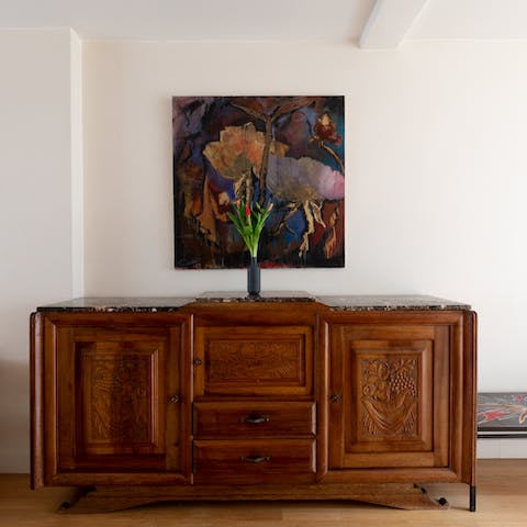Enjoy the elegant antique pieces and original artwork dotted around the home