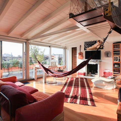 Lie back in the hammock with sun streaming in through sliding glass doors