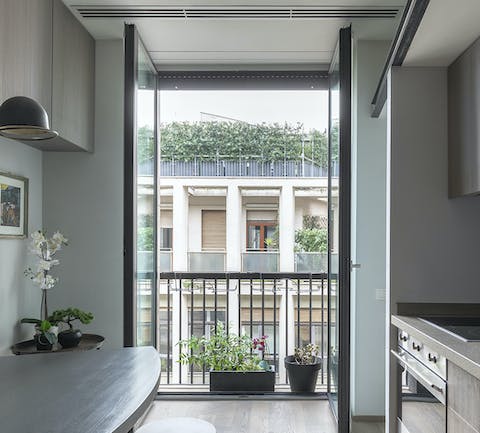 Throw open the kitchen's French doors to let a gentle Lombardy breeze drift through the home