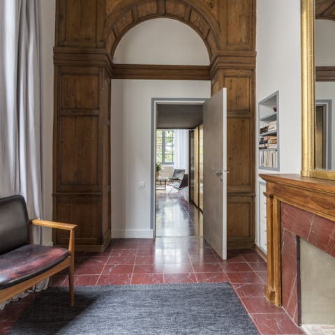 Stroll through the wooden arch leading to the master bedroom