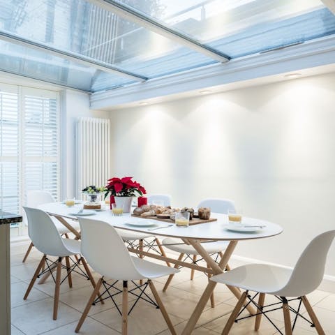 Dine indoors with that alfresco feeling under the impressive skylight