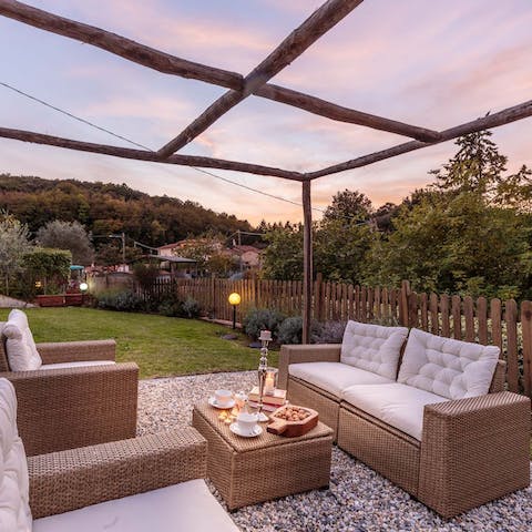 Sip on a Campari spritz in the outdoor seating area as the sunsets