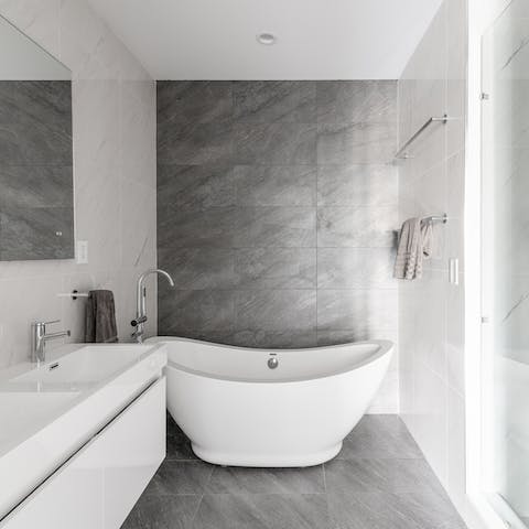 Indulge yourself with a soak in the ergonomic bathtub