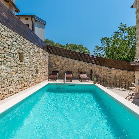 Spend sunny afternoons sprawled out by your private turquoise pool