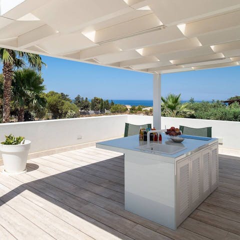 Enjoy cocktails and views at the rooftop bar