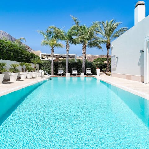 Cool off in the large, private and palm-lined pool