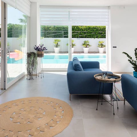 Slide open the doors and let the breeze in as you relax on the sofas